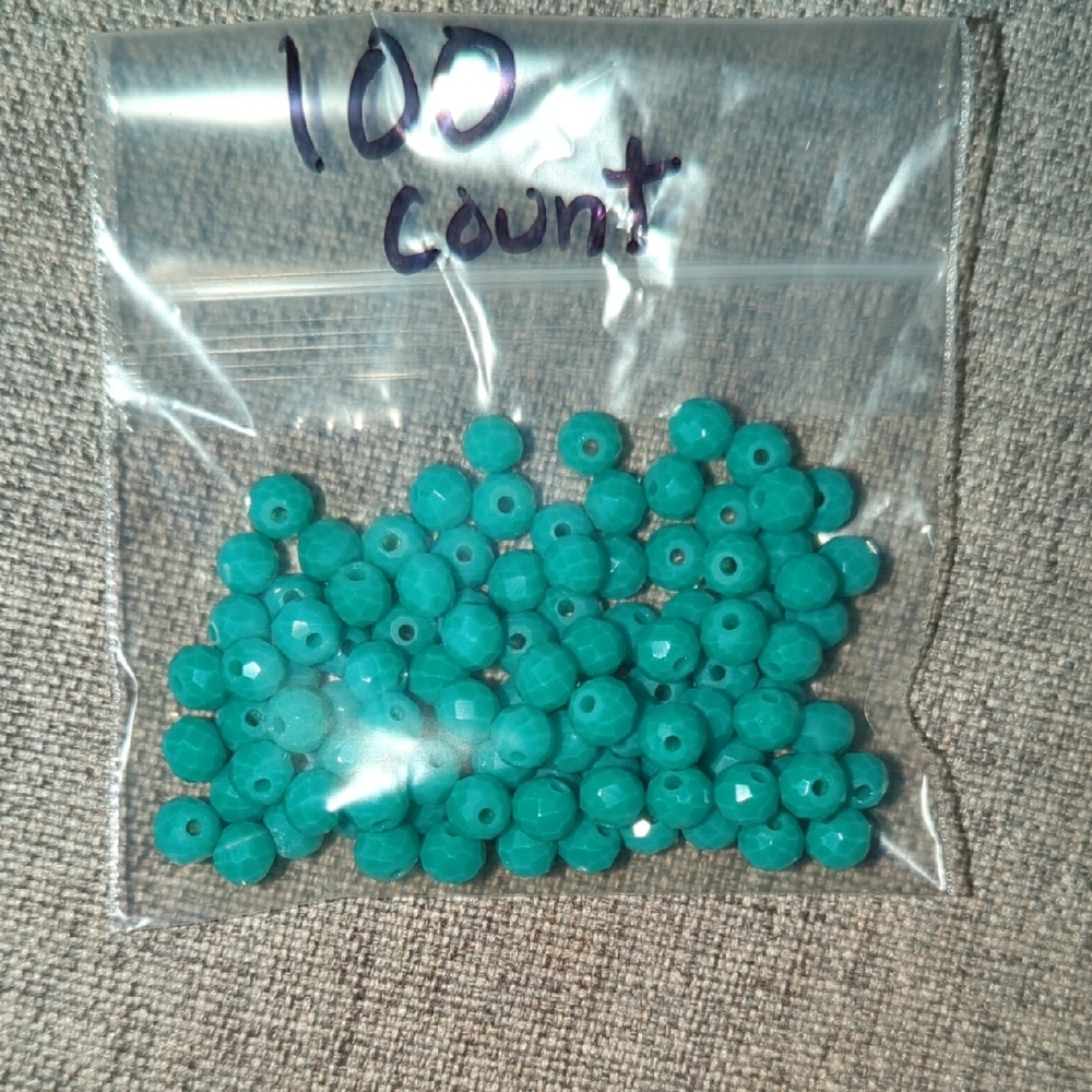 Turquoise Acrylic Crafting Beads With A Glossy Finish.